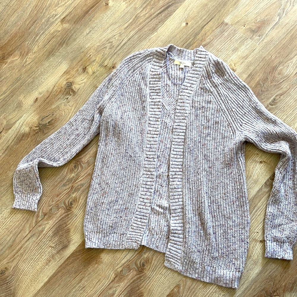 Purple cardigan.